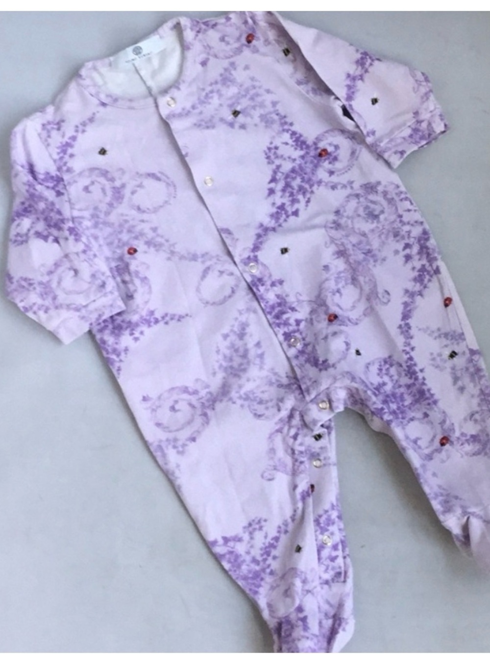 Versace Vintage Lavender Floral-Scroll Footed Baby One-Piece with Ladybug Accent